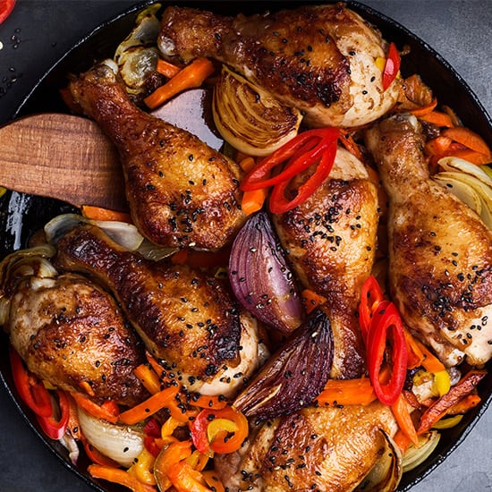 Chicken drumsticks with peppers displayed